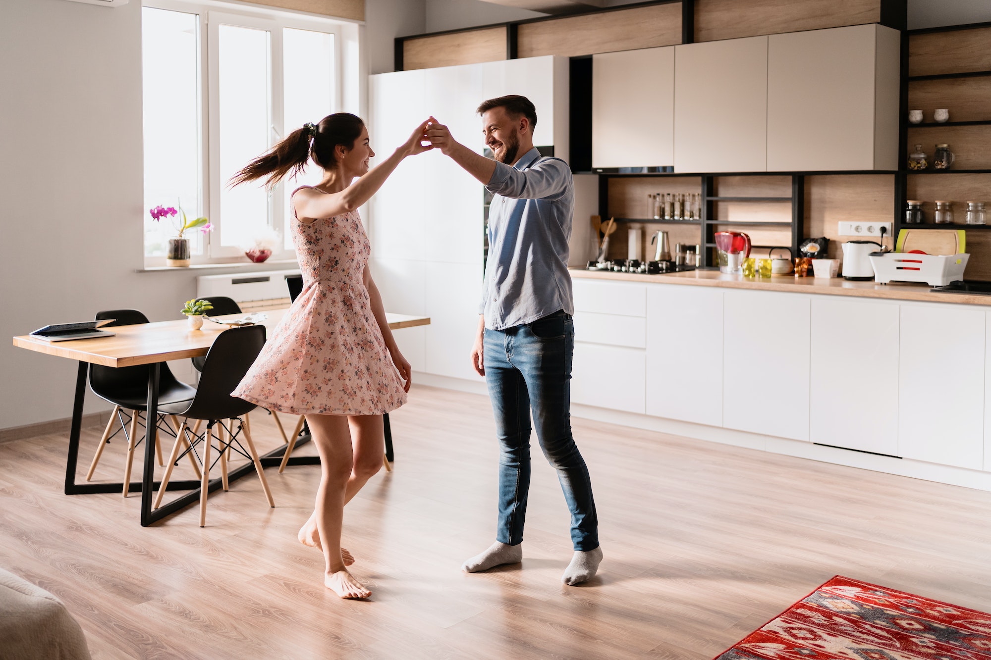Man and woman dancing in a modern interior